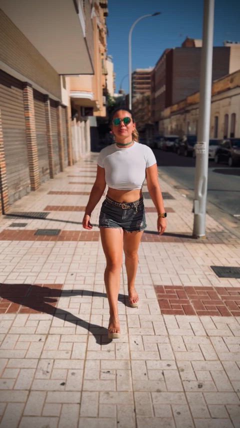 Braless Slut flashing tits in the street.