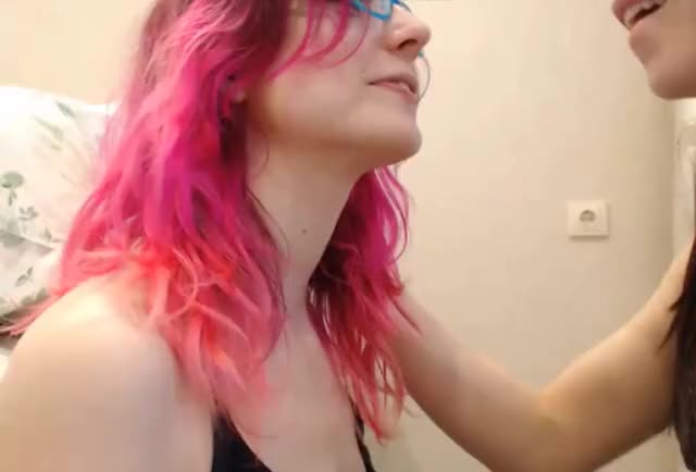 two teens kiss