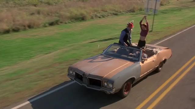 Vanessa Angel - Kingpin (1996) - dancing in tight short skirt in convertible car