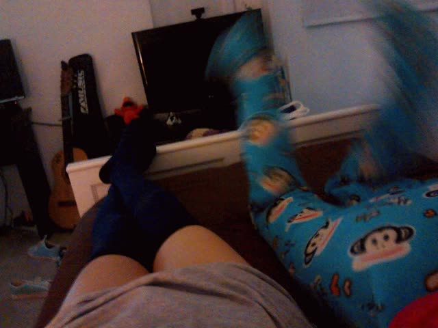 My boyfriend waving his legs on my footie PJs <3
