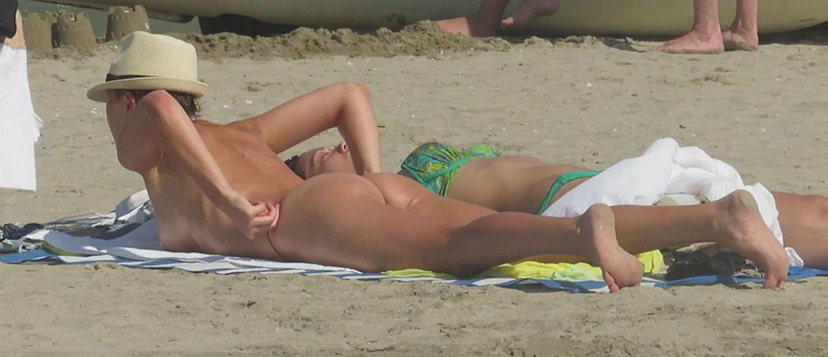 Fixing her tan lines