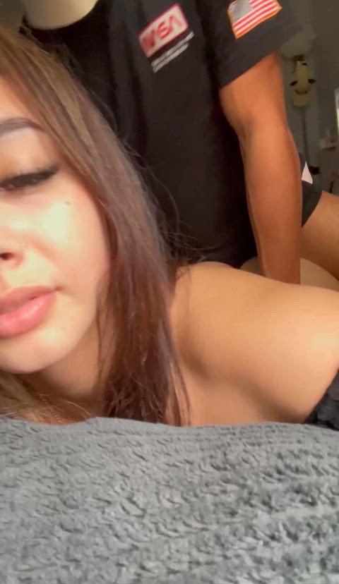 Arabian girl recording herself taking back shots 