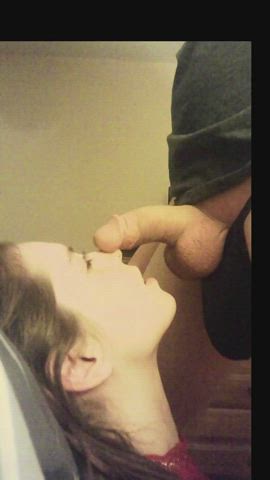 Teases the bulge before burying her face in the cock