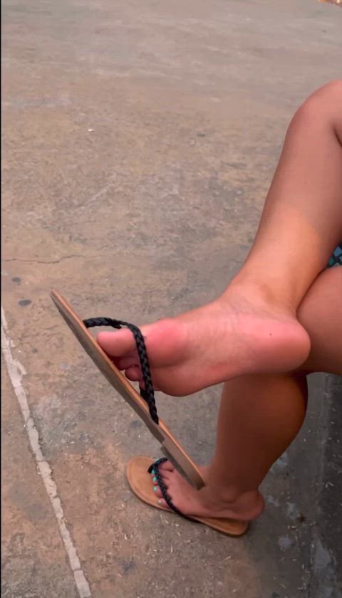 Dangling my flip flops in public