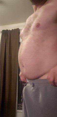 Dad bod in gray sweet pants trying to hide a hardon. Does not work so just letting