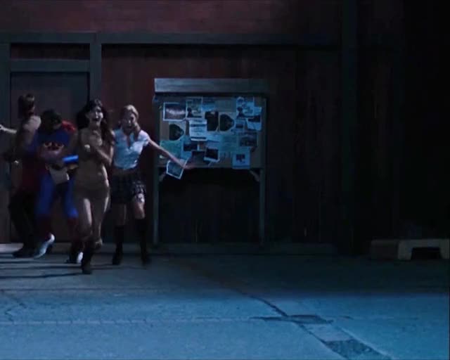 Diora Baird running and bouncing in Stan Helsing
