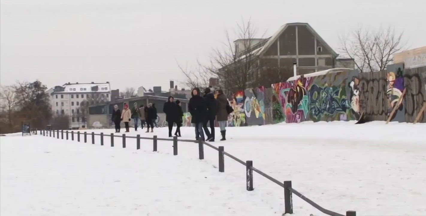 German MILF sucks black cock by the Berlin wall