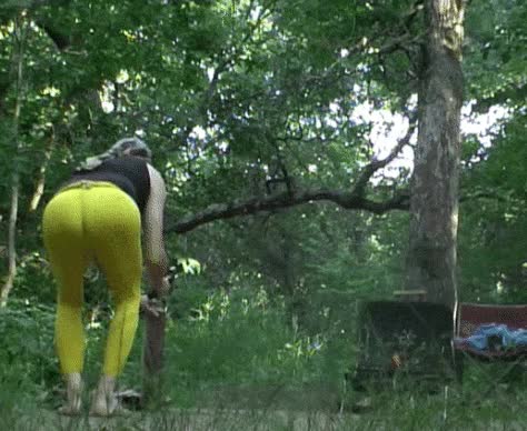 Yellow tights wood-chopping at Yellowstone Lake campground by Mark Heffron