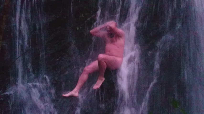 Nude night in the waterfall