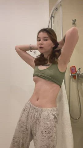 Kinky small girl playing with her titties