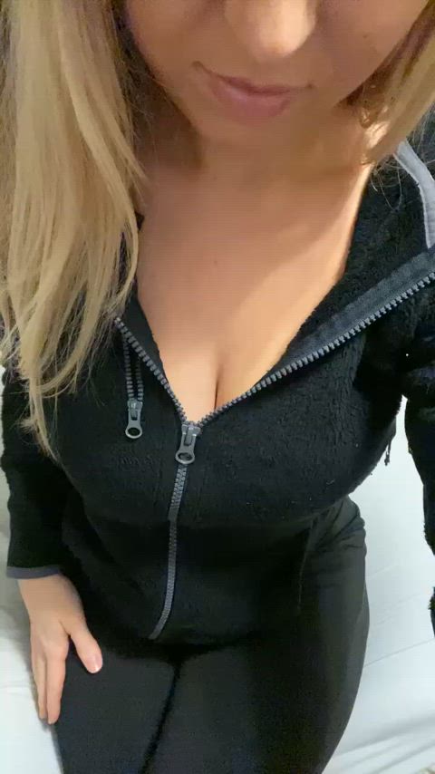 Pulling the zipper down to reveal my tits