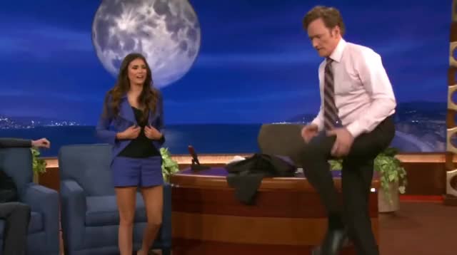 Nina Dobrev uses Conan as a yoga wall