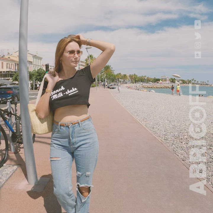 Braless walk by the sea