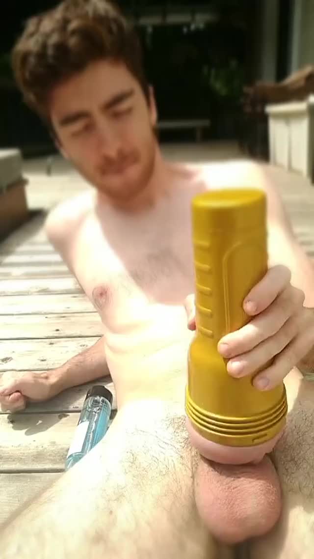 He has a fleshlight wank on his deck and busts a nut