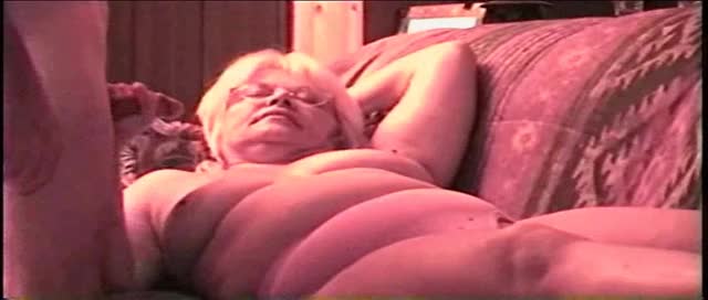 on her back in her pink panties sucking has a hole in the panties