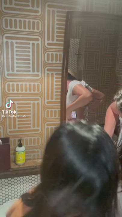 Red thong in a backless white dress