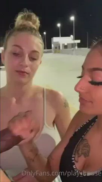 Two girls give head in the parking lot