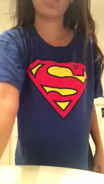Supergirl stripping in bathroom