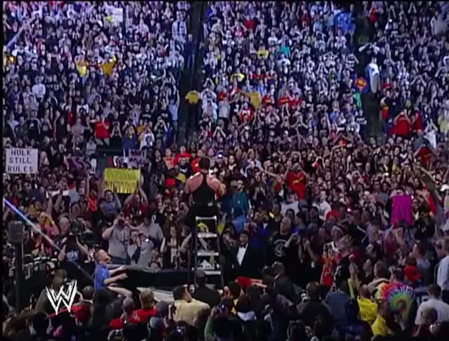 Mr McMahon drops the leg on Hogan, off a ladder, through the Spanish Announce Table