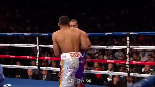 Keith Thurman sneaks a left hook behind Carlos Quintana’s elbow