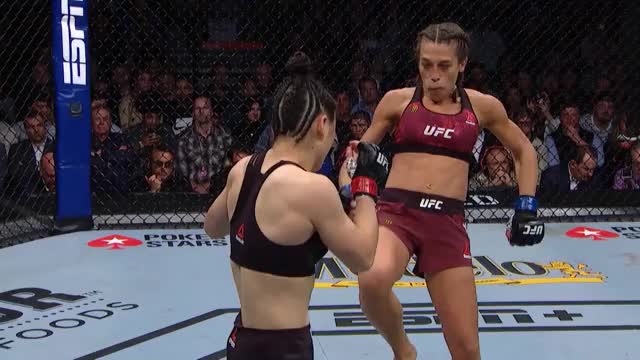 Zhang counters Joanna's front kick