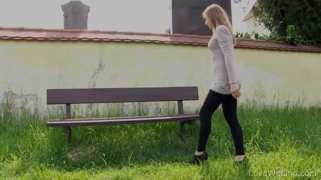 Luca+Bella pissing from a bench