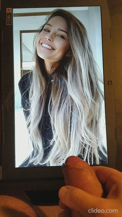 Rae's cute smiling face is an excellent target, almost a magnet for cum