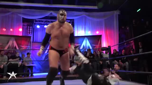 Kassius Ohno running the ropes