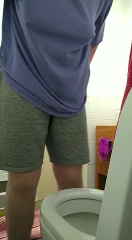 Sub Red trying to pee standing up. He desperately wants to be like one of the boys!