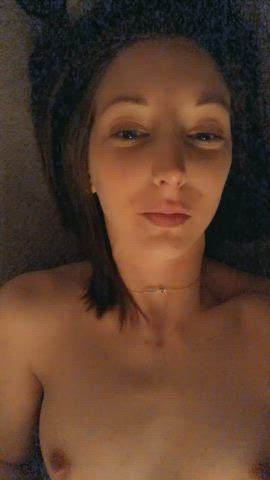 Brunette masturbating natural tits