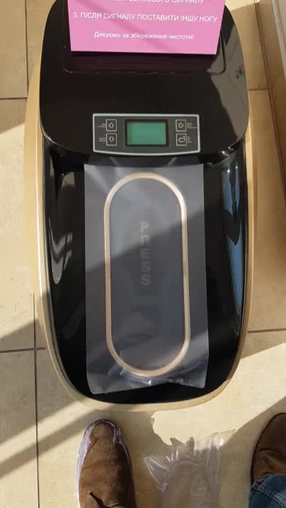 This automated heat-sealing shoe cover machine I just used