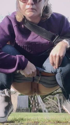 Older mom taking a quick pee outside