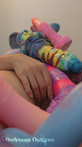 Playing with my fuzzy pussy while my fantasy toys are piled on top of me <3