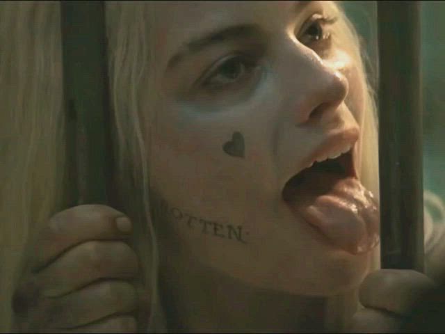 Margot Robbie licking a hard pole