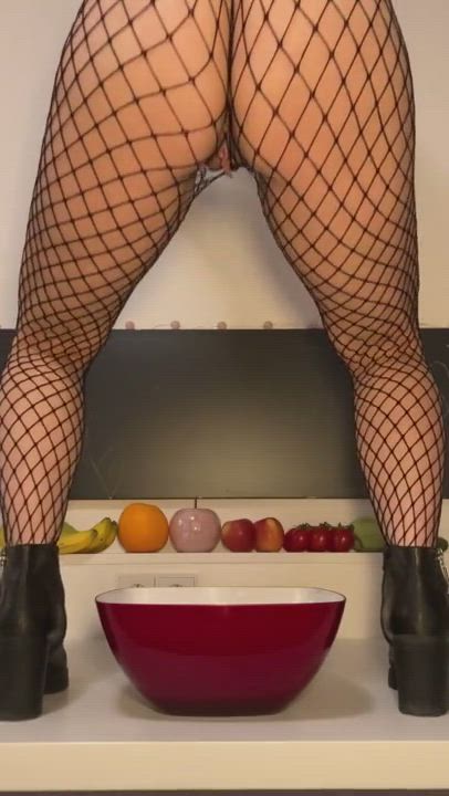 Filling her bowl with piss