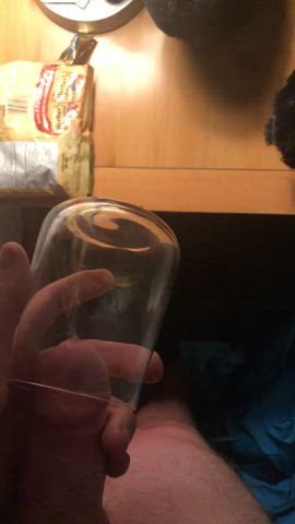 Hard dick pissing into glass