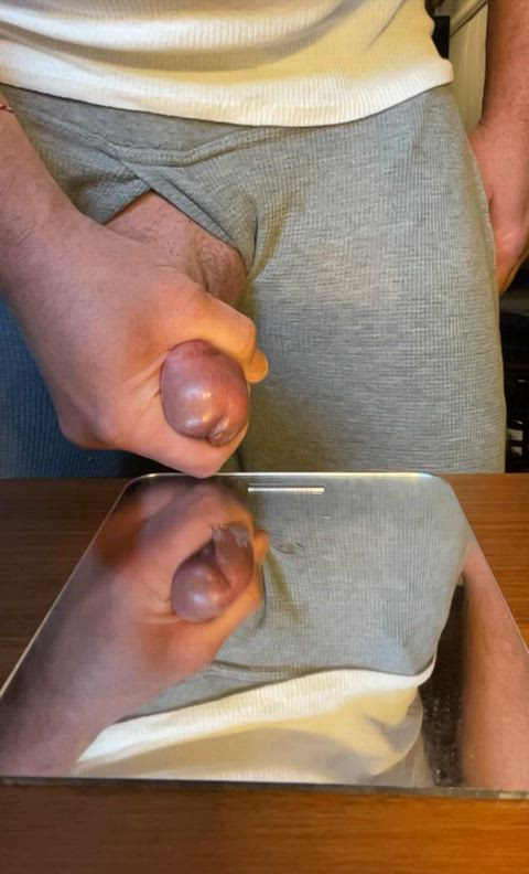 Unloading my full sack of sperm on a mirror while the wife is upstairs.