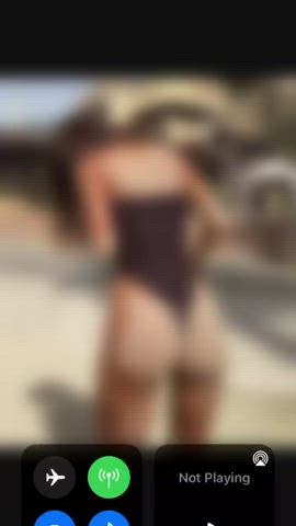 Shaking sandy ass in one piece thong suit