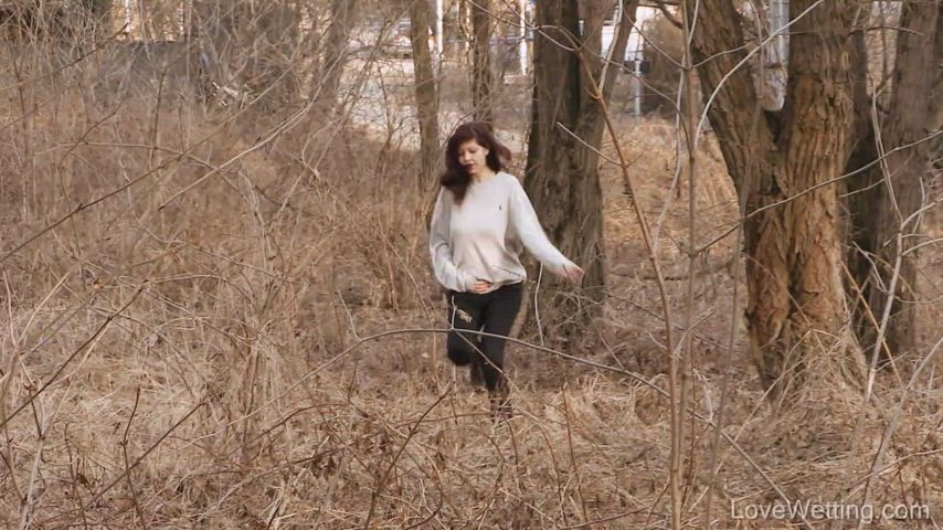 Rachel peeing in the woods