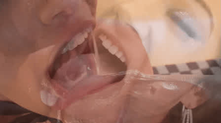 Cum slides down the back of her lewd tongue. Anyone know her name?