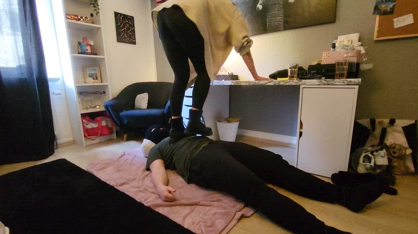 Extreme trampling in black combat boots