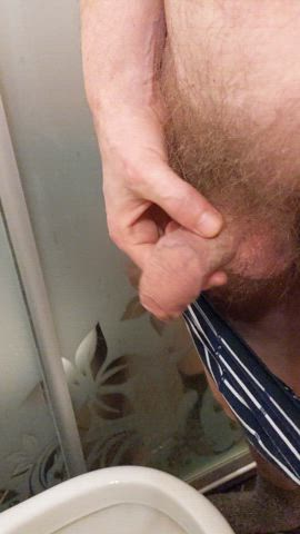 Uncut cock pissing