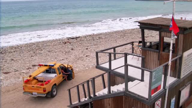 Vanessa Angel - Baywatch (S2E9, 1991) - walking up steps of lifeguard tower in red